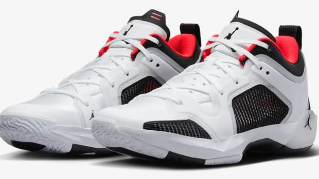 View of white, lack, and red Air Jordan shoes.